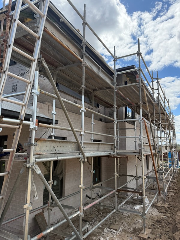 Close-up of multi-platform residential scaffolding